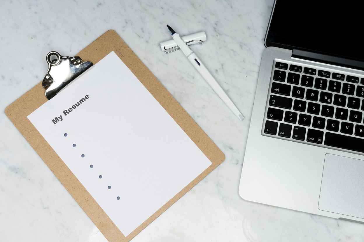 A notebook and pen on a desk — REAL ID checklist, not the star photo.